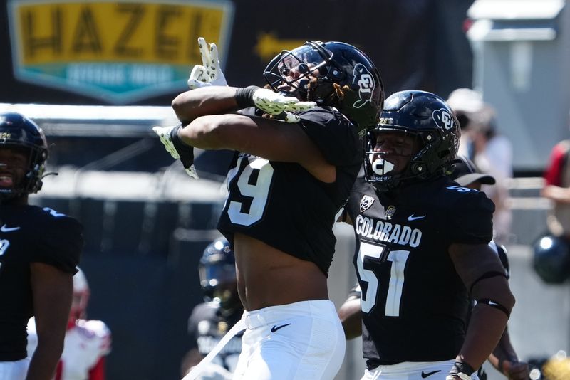 Sep 9, 2023; Boulder, Colorado, USA; Colorado Buffaloes defensive end Taijh Alston (49) celebrates his sack on Nebraska Cornhuskers quarterback Jeff Sims (7) (not pictured) in the third quarter at Folsom Field. Mandatory Credit: Ron Chenoy-USA TODAY Sports