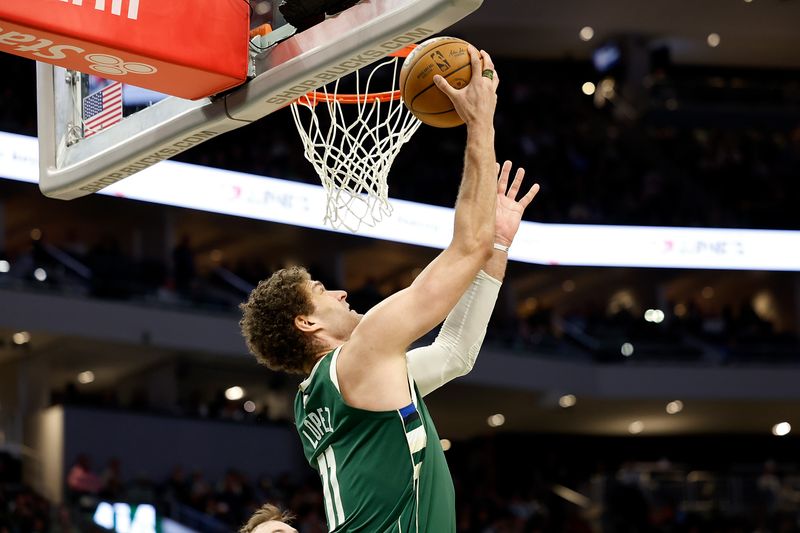 MILWAUKEE, WISCONSIN - APRIL 03: Brook Lopez #11 of the Milwaukee Bucks shoots the ball during the second half of the game against the Memphis Grizzlies at Fiserv Forum on April 03, 2024 in Milwaukee, Wisconsin. NOTE TO USER: User expressly acknowledges and agrees that, by downloading and or using this photograph, User is consenting to the terms and conditions of the Getty Images License Agreement. (Photo by John Fisher/Getty Images)