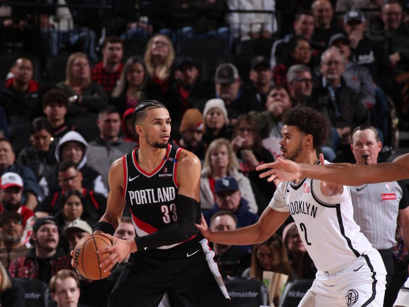 PORTLAND, OR - JANUARY 14: Toumani Camara #33 of the Portland Trail Blazers handles the ball during the game against the Brooklyn Nets on January 14, 2025 at the Moda Center Arena in Portland, Oregon. NOTE TO USER: User expressly acknowledges and agrees that, by downloading and or using this photograph, user is consenting to the terms and conditions of the Getty Images License Agreement. Mandatory Copyright Notice: Copyright 2025 NBAE (Photo by Cameron Browne/NBAE via Getty Images)