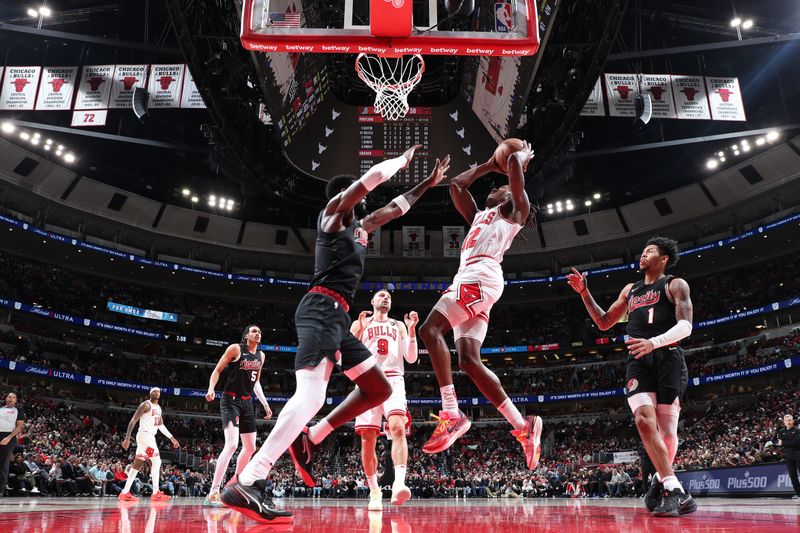 CHICAGO, IL - MARCH 18:  Ayo Dosunmu #12 of the Chicago Bulls drives to the basket during the game against the Portland Trail Blazers on March 18, 2024 at United Center in Chicago, Illinois. NOTE TO USER: User expressly acknowledges and agrees that, by downloading and or using this photograph, User is consenting to the terms and conditions of the Getty Images License Agreement. Mandatory Copyright Notice: Copyright 2024 NBAE (Photo by Jeff Haynes/NBAE via Getty Images)