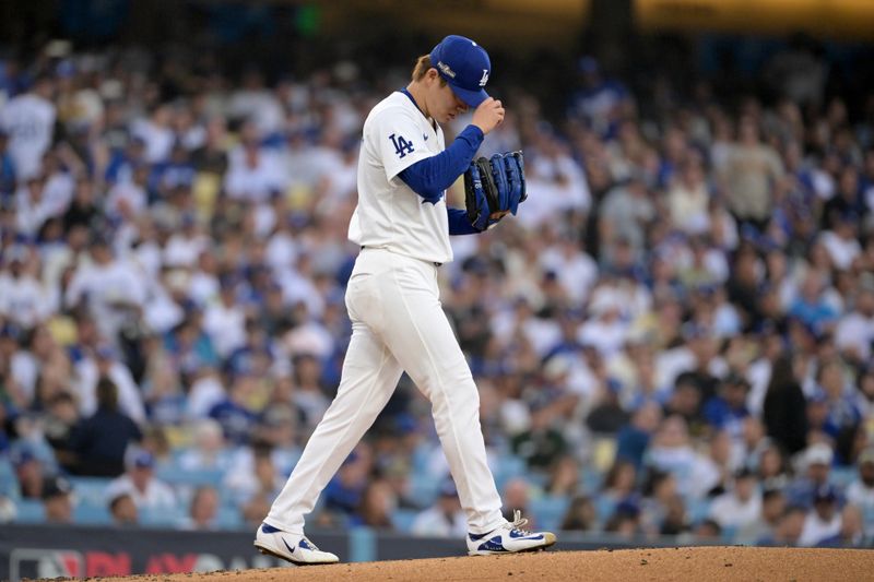 Oct 11, 2024; Los Angeles, California, USA; Los Angeles Dodgers pitcher Yoshinobu Yamamoto (18) reacts in the third inning against the San Diego Padres during game five of the NLDS for the 2024 MLB Playoffs at Dodger Stadium. Mandatory Credit: Jayne Kamin-Oncea-Imagn Images