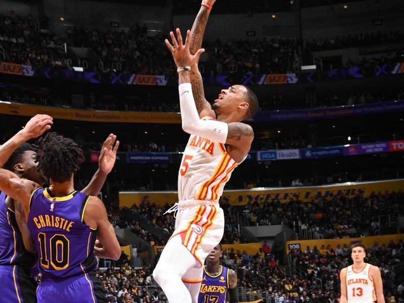 LOS ANGELES, CA - JANUARY 6: Dejounte Murray #5 of the Atlanta Hawks drives to the basket during the game against the Los Angeles Lakers /on January 6, 2023 at Crypto.Com Arena in Los Angeles, California. NOTE TO USER: User expressly acknowledges and agrees that, by downloading and/or using this Photograph, user is consenting to the terms and conditions of the Getty Images License Agreement. Mandatory Copyright Notice: Copyright 2023 NBAE (Photo by Andrew D. Bernstein/NBAE via Getty Images)