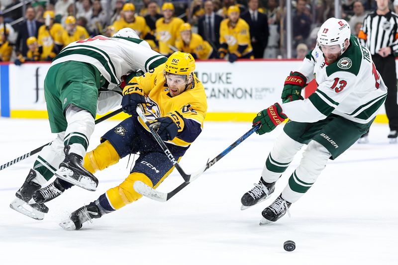 Nov 30, 2024; Saint Paul, Minnesota, USA; Minnesota Wild left wing Marcus Foligno (17) chekcs Nashville Predators center Tommy Novak (82) during the third period at Xcel Energy Center. Mandatory Credit: Matt Krohn-Imagn Images