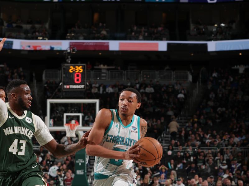 MILWAUKEE, WI - FEBRUARY 9: Nick Smith Jr. #8 of the Charlotte Hornets handles the ball during the game against the Milwaukee Bucks on February 9, 2024 at the Fiserv Forum Center in Milwaukee, Wisconsin. NOTE TO USER: User expressly acknowledges and agrees that, by downloading and or using this Photograph, user is consenting to the terms and conditions of the Getty Images License Agreement. Mandatory Copyright Notice: Copyright 2024 NBAE (Photo by Gary Dineen/NBAE via Getty Images).