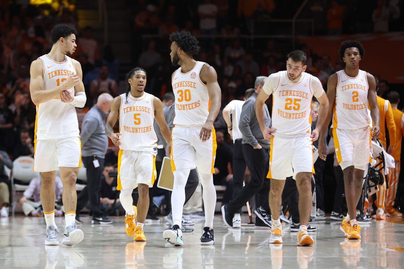 Feb 4, 2023; Knoxville, Tennessee, USA; Tennessee Volunteers forward Olivier Nkamhoua (13) and guard Zakai Zeigler (5) and guard Josiah-Jordan James (30) and guard Santiago Vescovi (25) and forward Julian Phillips (2) during the second half against the Auburn Tigers at Thompson-Boling Arena. Mandatory Credit: Randy Sartin-USA TODAY Sports