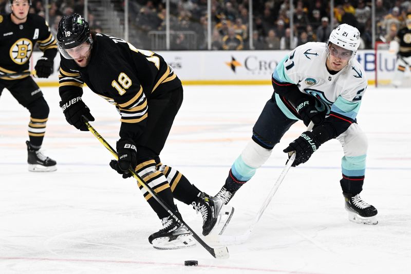 Feb 15, 2024; Boston, Massachusetts, USA; Boston Bruins center Pavel Zacha (18) battles for the puck against Seattle Kraken center Alex Wennberg (21) during the first period at TD Garden. Mandatory Credit: Brian Fluharty-USA TODAY Sports