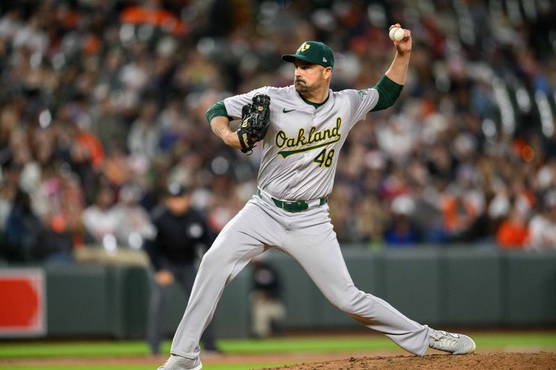 Apr 26, 2024; Baltimore, Maryland, USA; Oakland Athletics pitcher T.J. McFarland (48) throws a pitch during the seventh inning against the Baltimore Orioles at Oriole Park at Camden Yards. Mandatory Credit: Reggie Hildred-USA TODAY Sports