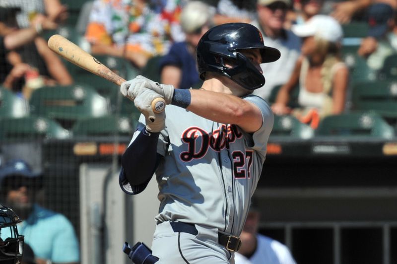 Aug 25, 2024; Chicago, Illinois, USA; Detroit Tigers shortstop Trey Sweeney (27) hits an RBI single during the fifth inning against the Chicago White Sox at Guaranteed Rate Field. Mandatory Credit: Patrick Gorski-USA TODAY Sports