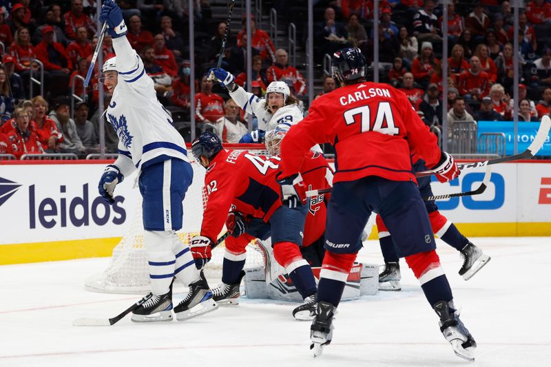 Oct 24, 2023; Washington, District of Columbia, USA; Toronto Maple Leafs center John Tavares (91) celebrates after scoring a goal on Washington Capitals goaltender Darcy Kuemper (35) in the second period at Capital One Arena. Mandatory Credit: Geoff Burke-USA TODAY Sports