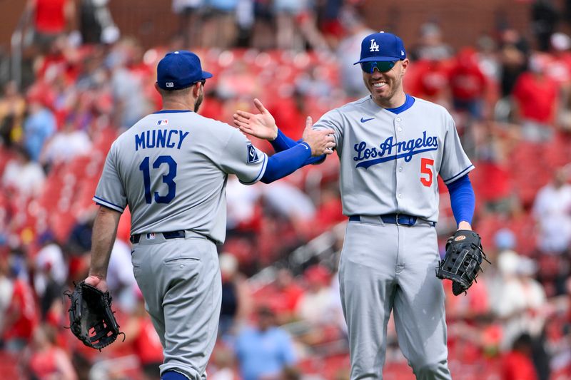 Jun 8, 2025; St. Louis, Missouri, USA;  Los Angeles Dodgers first baseman Freddie Freeman (5) celebrates with third baseman Max Muncy (13) after the Dodgers defeated the St. Louis Cardinals at Busch Stadium. Mandatory Credit: Jeff Curry-Imagn Images