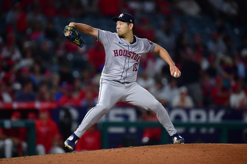 Sep 13, 2024; Anaheim, California, USA; Houston Astros pitcher Yusei Kikuchi (16) throws against the Los Angeles Angels during the third inning at Angel Stadium. Mandatory Credit: Gary A. Vasquez-Imagn Images