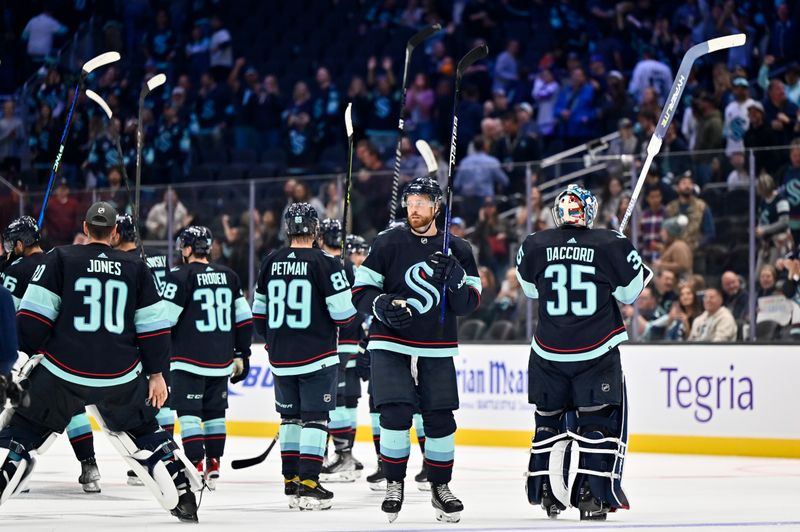 Sep 26, 2022; Seattle, Washington, USA; The Seattle Kraken celebrate after defeating the Edmonton Oilers at Climate Pledge Arena. Mandatory Credit: Steven Bisig-USA TODAY Sports