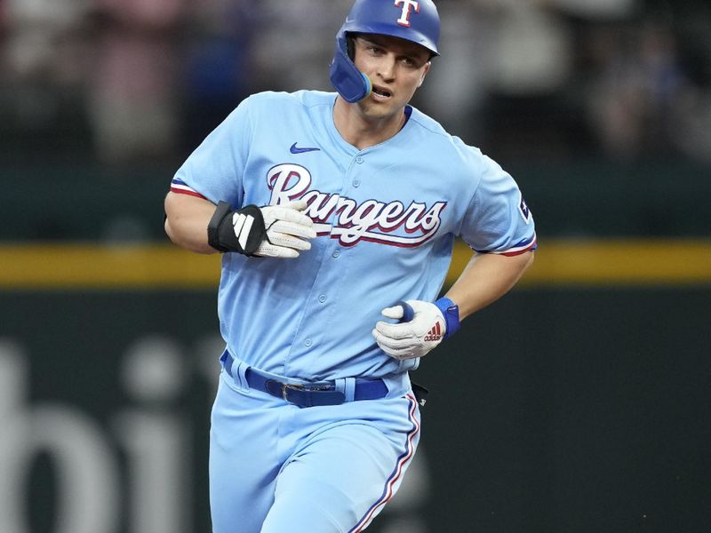 Aug 20, 2023; Arlington, Texas, USA; Texas Rangers shortstop Corey Seager (5) circles the bases on his solo home run against the Milwaukee Brewers during the third inning at Globe Life Field. Mandatory Credit: Jim Cowsert-USA TODAY Sports