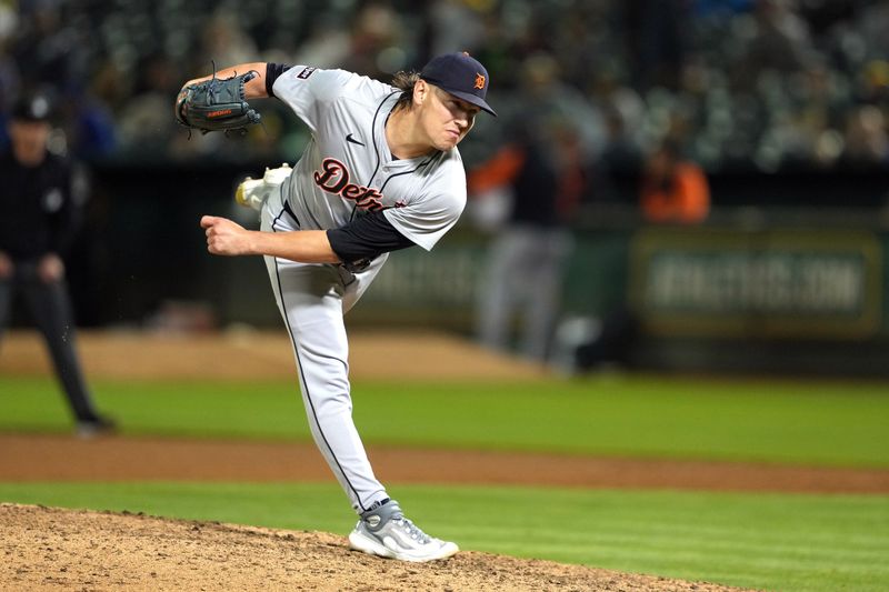 Sep 6, 2024; Oakland, California, USA; Detroit Tigers relief pitcher Tyler Holton (87) throws a pitch against the Oakland Athletics during the ninth inning at Oakland-Alameda County Coliseum. Mandatory Credit: Darren Yamashita-Imagn Images