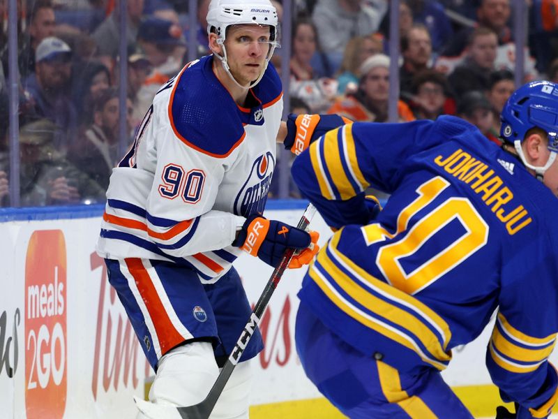 Mar 9, 2024; Buffalo, New York, USA;  Edmonton Oilers right wing Corey Perry (90) looks for the puck during the third period against the Buffalo Sabres at KeyBank Center. Mandatory Credit: Timothy T. Ludwig-USA TODAY Sports