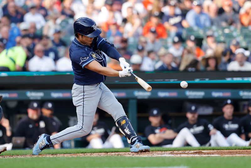 Jul 8, 2025; Detroit, Michigan, USA;  Tampa Bay Rays shortstop Ha-Seong Kim (7) hits a single in the second inning against the Detroit Tigers at Comerica Park. Mandatory Credit: Rick Osentoski-Imagn Images