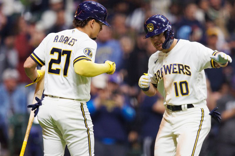 Apr 24, 2023; Milwaukee, Wisconsin, USA;  Milwaukee Brewers third baseman Mike Brosseau (10) celebrates with designated hitter Willy Adames (27) after hitting a home run during the third inning against the Detroit Tigers at American Family Field. Mandatory Credit: Jeff Hanisch-USA TODAY Sports