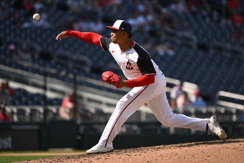 Sep 15, 2024; Washington, District of Columbia, USA; Washington Nationals relief pitcher Eduardo Salazar (62) throws a pitch against the Miami Marlins during the seventh inning at Nationals Park. Mandatory Credit: Rafael Suanes-Imagn Images