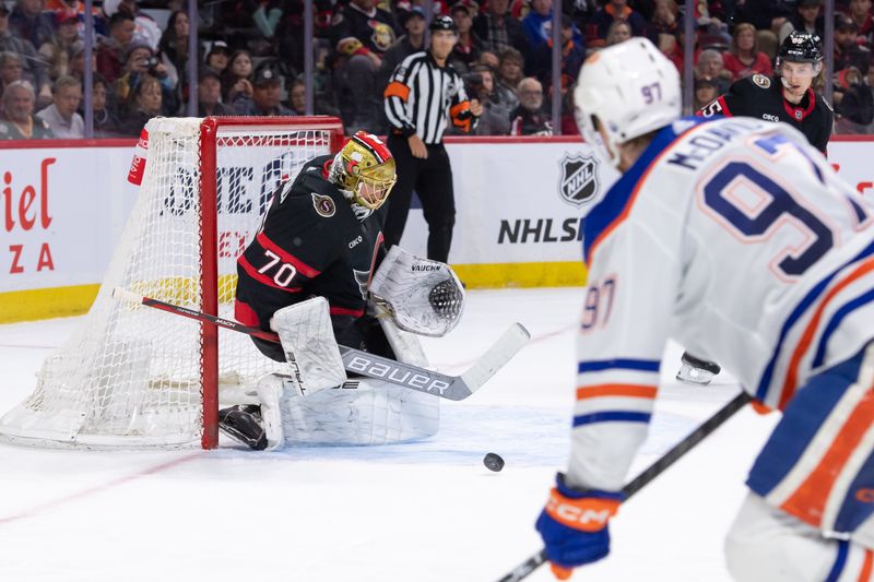 Mar 24, 2024; Ottawa, Ontario, CAN; Edmonton Oilers center Connor McDavid (87) shoots on Ottawa Senators goalie Joonas Korpisalo (70) in the second period at the Canadian Tire Centre. Mandatory Credit: Marc DesRosiers-USA TODAY Sports