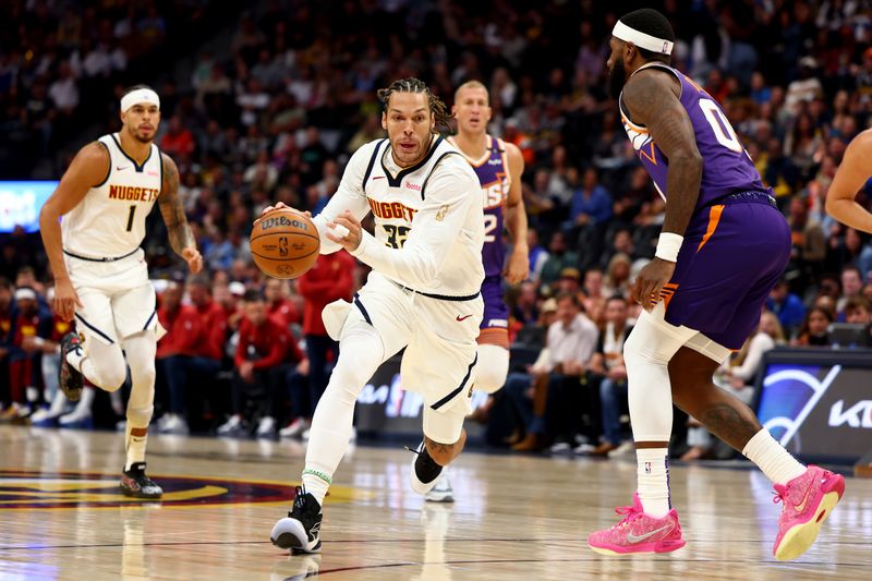 DENVER, COLORADO - OCTOBER 13: Aaron Gordon #32 of the Denver Nuggets drives to the basket against the Phoenix Suns at Ball Arena on October 13, 2024 in Denver, Colorado. NOTE TO USER: User expressly acknowledges and agrees that, by downloading and/or using this Photograph, user is consenting to the terms and conditions of the Getty Images License Agreement. (Photo by Jamie Schwaberow/Getty Images)