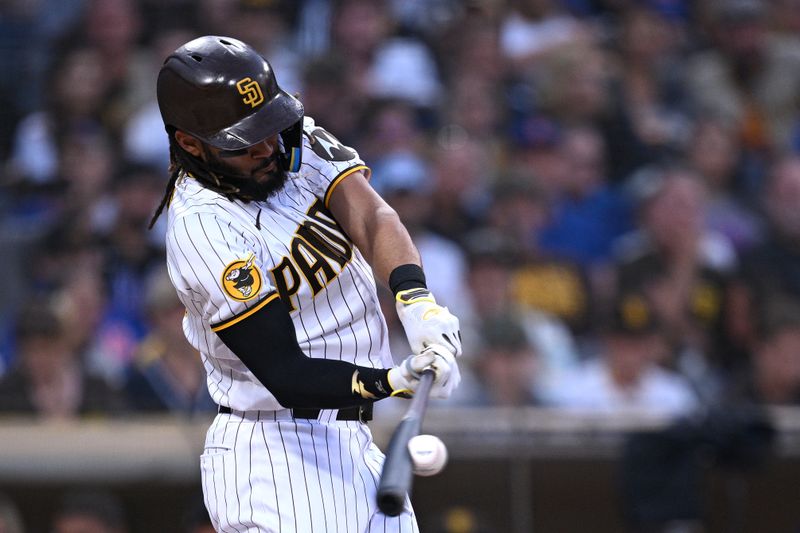 Jul 8, 2023; San Diego, California, USA; San Diego Padres right fielder Fernando Tatis Jr. (23) hits a single against the New York Mets during the third inning at Petco Park. Mandatory Credit: Orlando Ramirez-USA TODAY Sports