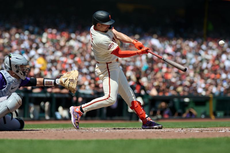 May 4, 2025; San Francisco, California, USA; San Francisco Giants shortstop Willy Adames (2) hits an RBI double against the Colorado Rockies during the fifth inning at Oracle Park. Mandatory Credit: Robert Edwards-Imagn Images