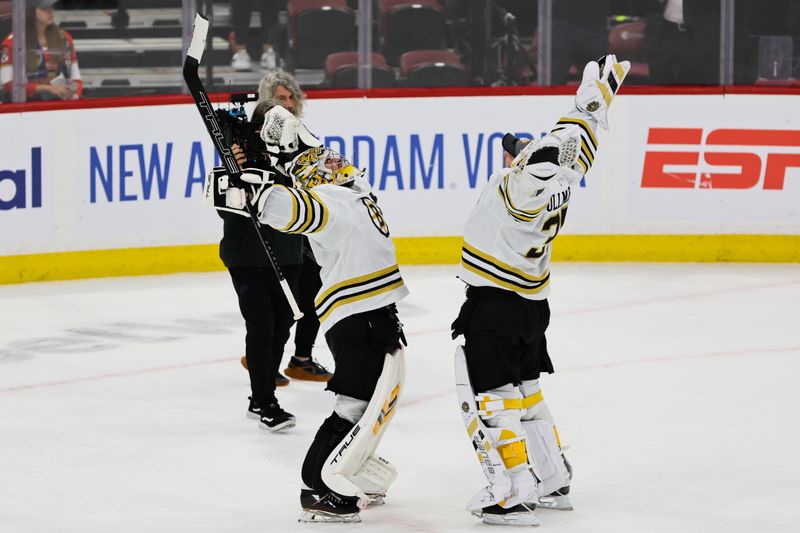May 6, 2024; Sunrise, Florida, USA; Boston Bruins goaltender Jeremy Swayman (1) and goaltender Linus Ullmark (35) celebrate after defeating the Florida Panthers in game one of the second round of the 2024 Stanley Cup Playoffs at Amerant Bank Arena. Mandatory Credit: Sam Navarro-USA TODAY Sports