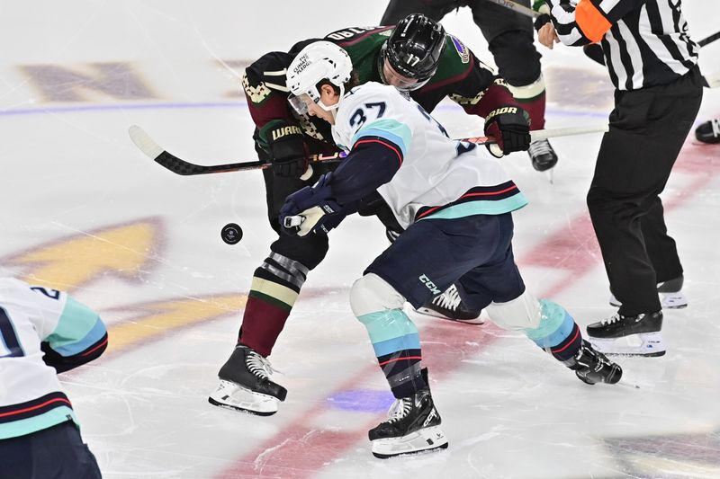 Nov 7, 2023; Tempe, Arizona, USA; Arizona Coyotes center Nick Bjugstad (17) and Seattle Kraken center Yanni Gourde (37) take the opening face off in the first period at Mullett Arena. Mandatory Credit: Matt Kartozian-USA TODAY Sports