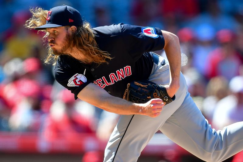 May 26, 2024; Anaheim, California, USA; Cleveland Guardians pitcher Scott Barlow (58) throws against the Los Angeles Angels during the eighth inning at Angel Stadium. Mandatory Credit: Gary A. Vasquez-USA TODAY Sports