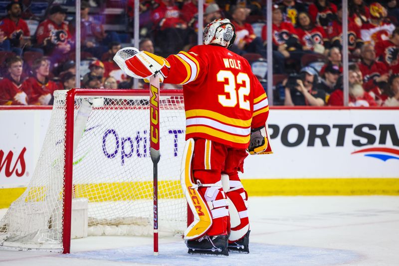 Apr 18, 2024; Calgary, Alberta, CAN; Calgary Flames goaltender Dustin Wolf (32) reacts to the goal by San Jose Sharks left wing Fabian Zetterlund (not pictured) during the third period at Scotiabank Saddledome. Mandatory Credit: Sergei Belski-USA TODAY Sports