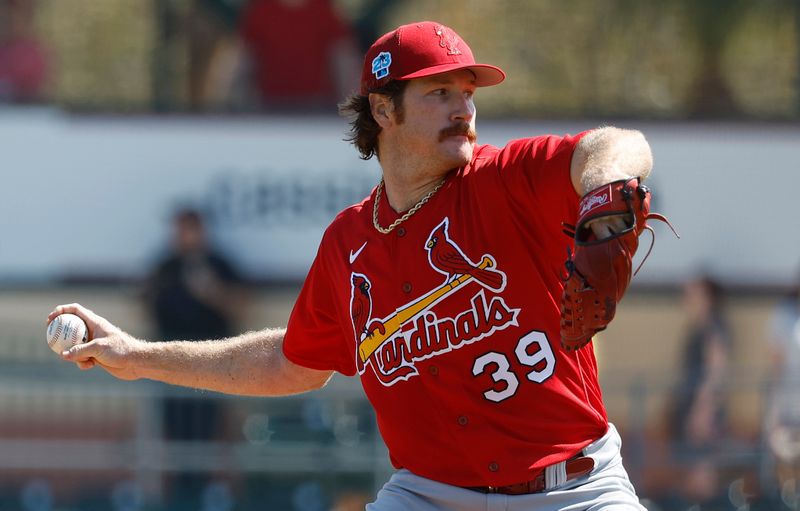 Feb 26, 2023; Jupiter, Florida, USA; St. Louis Cardinals starting starting pitcher Miles Mikolas (39) pitches in the fist inning against the Miami Marlins at Roger Dean Stadium. Mandatory Credit: Rhona Wise-USA TODAY Sports