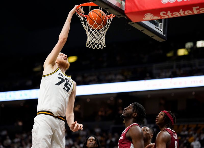 Jan 31, 2024; Columbia, Missouri, USA; Missouri Tigers center Connor Vanover (75) dunks the ball against the Arkansas Razorbacks during the first half at Mizzou Arena. Mandatory Credit: Jay Biggerstaff-USA TODAY Sports