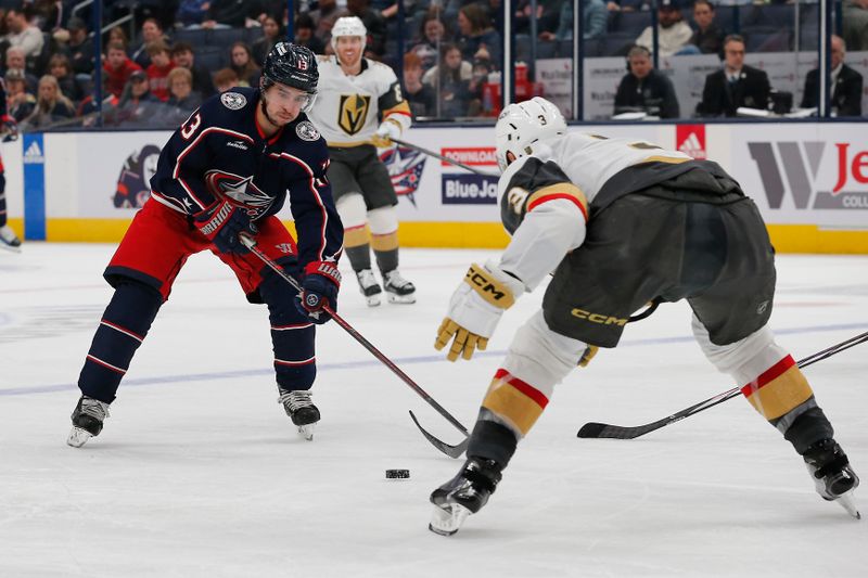 Mar 4, 2024; Columbus, Ohio, USA; Columbus Blue Jackets left wing Johnny Gaudreau (13) passes the puck as Vegas Golden Knights defenseman Brayden McNabb (3) defends during the second period at Nationwide Arena. Mandatory Credit: Russell LaBounty-USA TODAY Sports