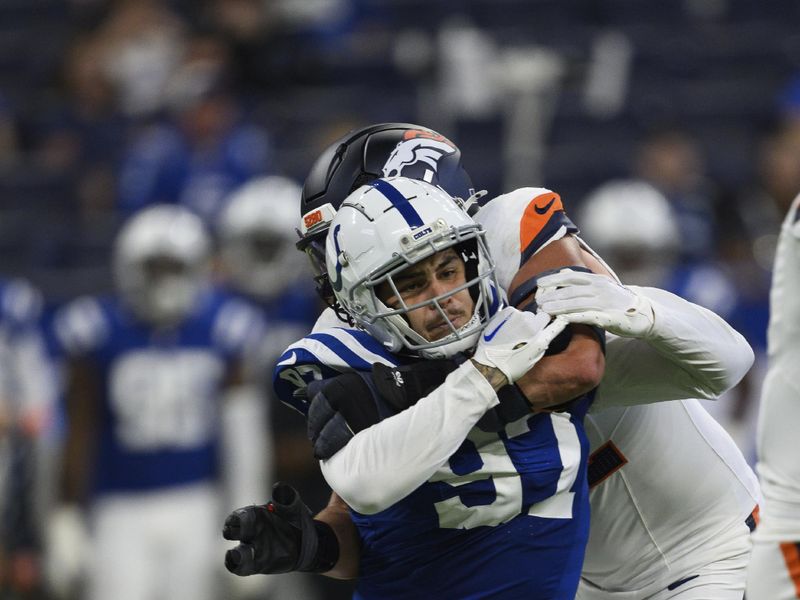 Indianapolis Colts defensive end Laiatu Latu (97) rushes around the edge during an NFL football game against the Denver Broncos, Sunday, Aug. 11, 2024, in Indianapolis. (AP Photo/Zach Bolinger)