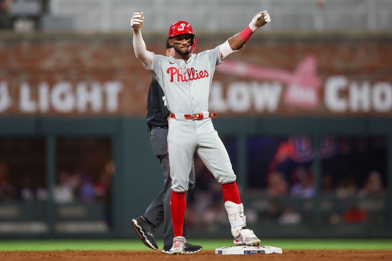 Aug 21, 2024; Atlanta, Georgia, USA; Philadelphia Phillies center fielder Johan Rojas (18) celebrates after a double against the Atlanta Braves in the sixth inning at Truist Park. Mandatory Credit: Brett Davis-USA TODAY Sports