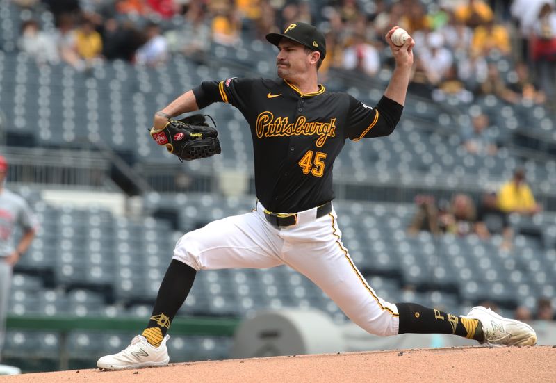 May 21, 2025; Pittsburgh, Pennsylvania, USA;  Pittsburgh Pirates starting pitcher Andrew Heaney (45) delivers a pitch against the Cincinnati Reds during the first inning at PNC Park. Mandatory Credit: Charles LeClaire-Imagn Images