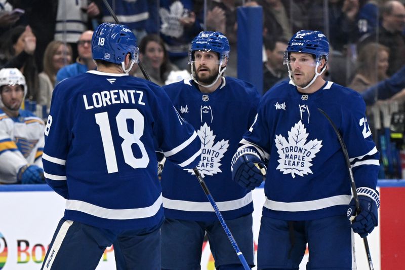 Nov 18, 2025; Toronto, Ontario, CAN; Toronto Maple Leafs defenseman Jake McCabe (22) celebrates with defenseman Oliver Ekman-Larson (95) and forward Steven Lorentz (18)after scoring a goal against the St. Louis Blues in the first period at Scotiabank Arena. Mandatory Credit: Dan Hamilton-Imagn Images Nov 18, 2025; Toronto, Ontario, CAN; Toronto Maple Leafs defenseman Jake McCabe (22) celebrates with defenseman Oliver Ekman-Larson (95) and forward Steven Lorentz (18)after scoring a goal against the St. Louis Blues in the first period at Scotiabank Arena. Mandatory Credit: Dan Hamilton-Imagn Images