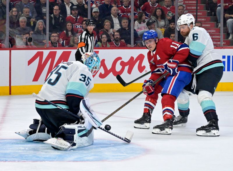 Oct 14, 2025; Montreal, Quebec, CAN; Seattle Kraken goalie Joey Daccord (35) stopMontreal Canadiens forward Brendan Gallagher (11) during the second period at the Bell Centre. Mandatory Credit: Eric Bolte-Imagn Images