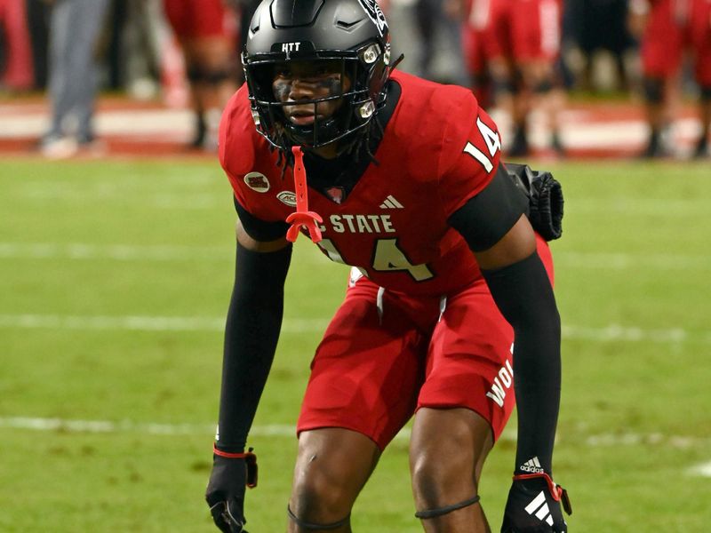 Nov 4, 2023; Raleigh, North Carolina, USA;  North Carolina State Wolfpack cornerback Rente Hinton (14) warms up prior to a game against the Miami Hurricanes at Carter-Finley Stadium. Mandatory Credit: Rob Kinnan-USA TODAY Sports