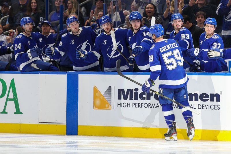 Oct 2, 2025; Tampa, Florida, USA; Tampa Bay Lightning center Jake Guentzel (59) celebrates after scoring a goal against the Tampa Bay Lightning in the third period at Benchmark International Arena. Mandatory Credit: Nathan Ray Seebeck-Imagn Images