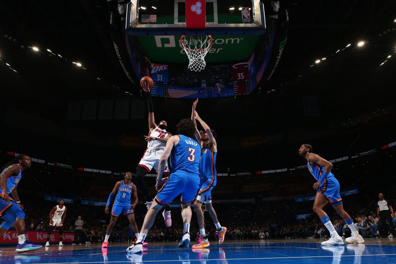 OKLAHOMA CITY, OK - MARCH 8: Caleb Martin #16 of the Miami Heat drives to the basket during the game against the Oklahoma City Thunder on March 8, 2024 at Paycom Arena in Oklahoma City, Oklahoma. NOTE TO USER: User expressly acknowledges and agrees that, by downloading and or using this photograph, User is consenting to the terms and conditions of the Getty Images License Agreement. Mandatory Copyright Notice: Copyright 2024 NBAE (Photo by Zach Beeker/NBAE via Getty Images)