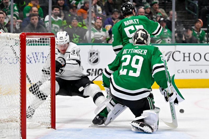 Jan 16, 2024; Dallas, Texas, USA; Dallas Stars defenseman Thomas Harley (55) checks Los Angeles Kings right wing Arthur Kaliyev (34) as he attempts a shot on Stars goaltender Jake Oettinger (29) during the third period at the American Airlines Center. Mandatory Credit: Jerome Miron-USA TODAY Sports