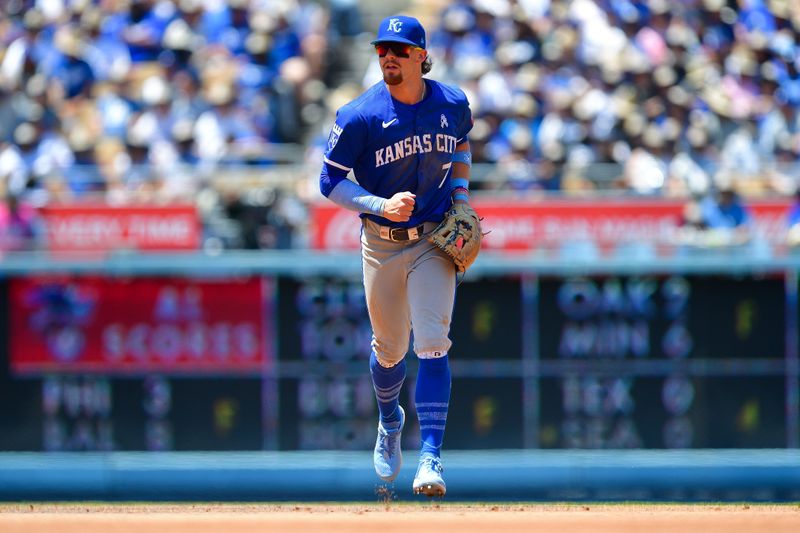 Jun 16, 2024; Los Angeles, California, USA; Kansas City Royals shortstop Bobby Witt Jr. (7) returns to the dugout following the fourth inning against the Los Angeles Dodgers at Dodger Stadium. Mandatory Credit: Gary A. Vasquez-USA TODAY Sports