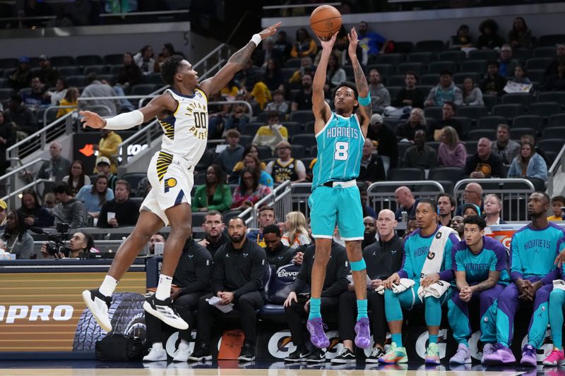 INDIANAPOLIS, INDIANA - OCTOBER 17: Nick Smith Jr. #8 of the Charlotte Hornets attempts a shot while being guarded by Bennedict Mathurin #00 of the Indiana Pacers in the second quarter during a preseason game at Gainbridge Fieldhouse on October 17, 2024 in Indianapolis, Indiana. NOTE TO USER: User expressly acknowledges and agrees that, by downloading and or using this photograph, User is consenting to the terms and conditions of the Getty Images License Agreement. (Photo by Dylan Buell/Getty Images)