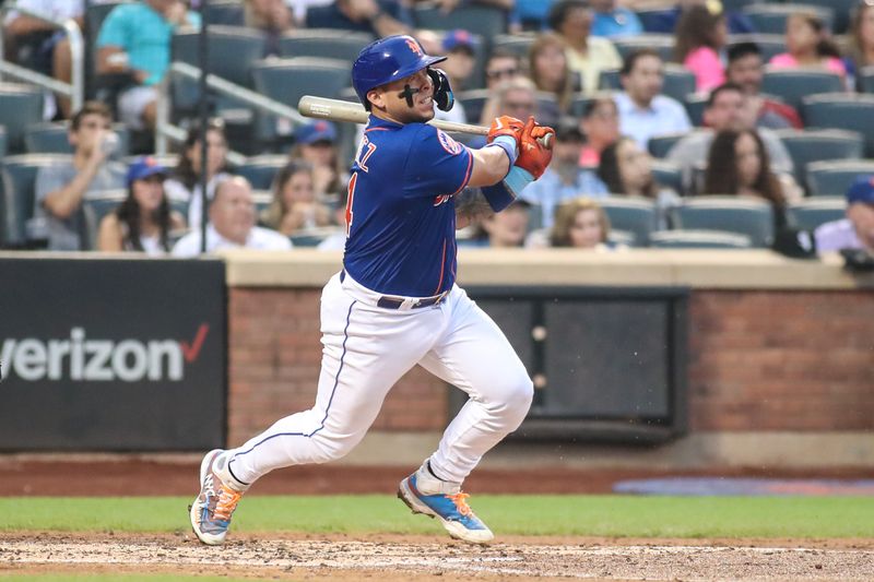 Jul 19, 2023; New York City, New York, USA;  New York Mets catcher Francisco Alvarez (4) hits an RBI single in the fourth inning against the Chicago White Sox at Citi Field. Mandatory Credit: Wendell Cruz-USA TODAY Sports