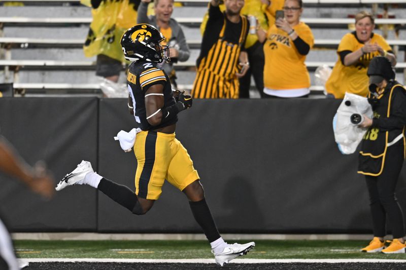 Sep 17, 2022; Iowa City, Iowa, USA; Iowa Hawkeyes running back Kaleb Johnson (2) runs for a touchdown against the Nevada Wolf Pack during the fourth quarter at Kinnick Stadium. Mandatory Credit: Jeffrey Becker-USA TODAY Sports