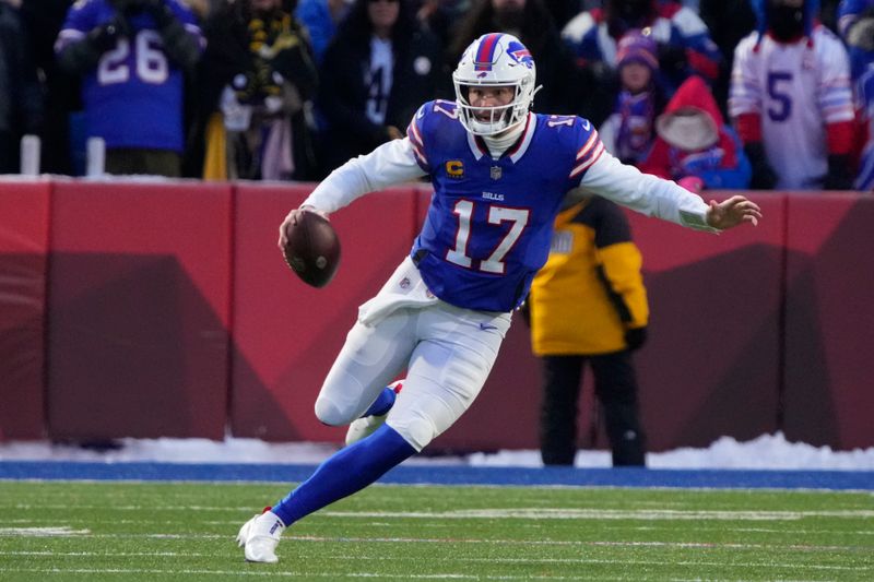 Buffalo Bills quarterback Josh Allen (17) runs the ball against the Pittsburgh Steelers during an NFL wild-card playoff football game, Monday, Jan. 15, 2024 in in Orchard Park, NY. (AP Photo/Rick Scuteri)