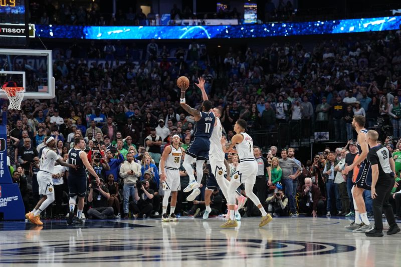 DALLAS, TX - MARCH 17: Kyrie Irving #11 of the Dallas Mavericks shoots the game winning basket against the Denver Nuggets on March 17, 2024 at the American Airlines Center in Dallas, Texas. NOTE TO USER: User expressly acknowledges and agrees that, by downloading and or using this photograph, User is consenting to the terms and conditions of the Getty Images License Agreement. Mandatory Copyright Notice: Copyright 2024 NBAE (Photo by Glenn James/NBAE via Getty Images)