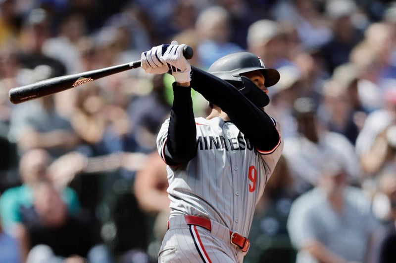 Jun 30, 2024; Seattle, Washington, USA; Minnesota Twins left fielder Trevor Larnach (9) hits a two-run home run against the Seattle Mariners during the eighth inning at T-Mobile Park. Mandatory Credit: John Froschauer-USA TODAY Sports