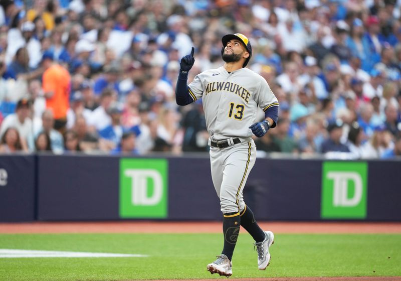 May 31, 2023; Toronto, Ontario, CAN; Milwaukee Brewers third baseman Abraham Toro (13) celebrates hitting a two-run home run against the Toronto Blue Jays during the second inning at Rogers Centre. Mandatory Credit: Nick Turchiaro-USA TODAY Sports